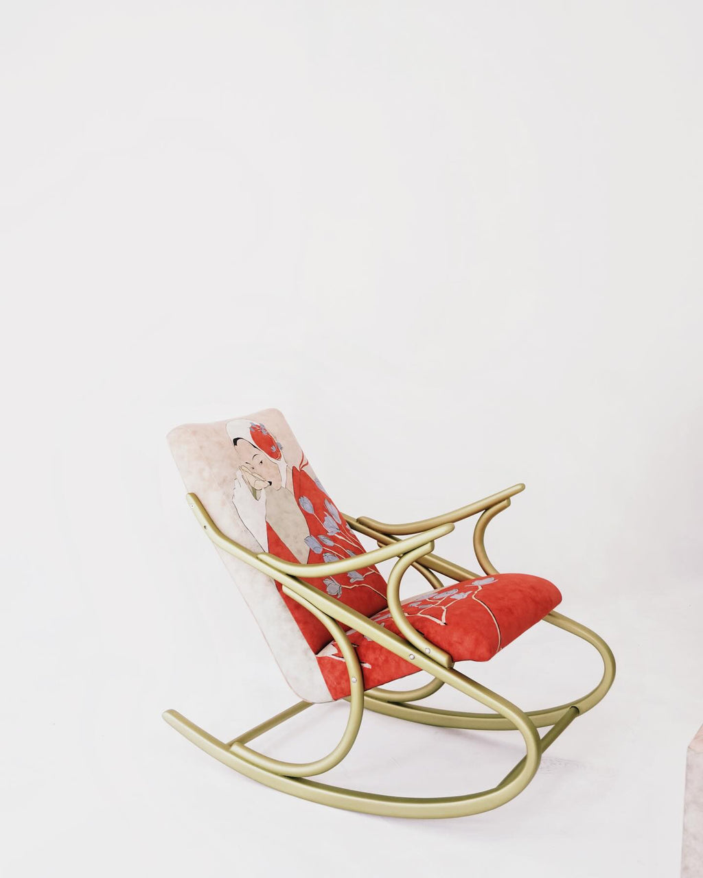 Gold rocking chair with red illustration on a white background