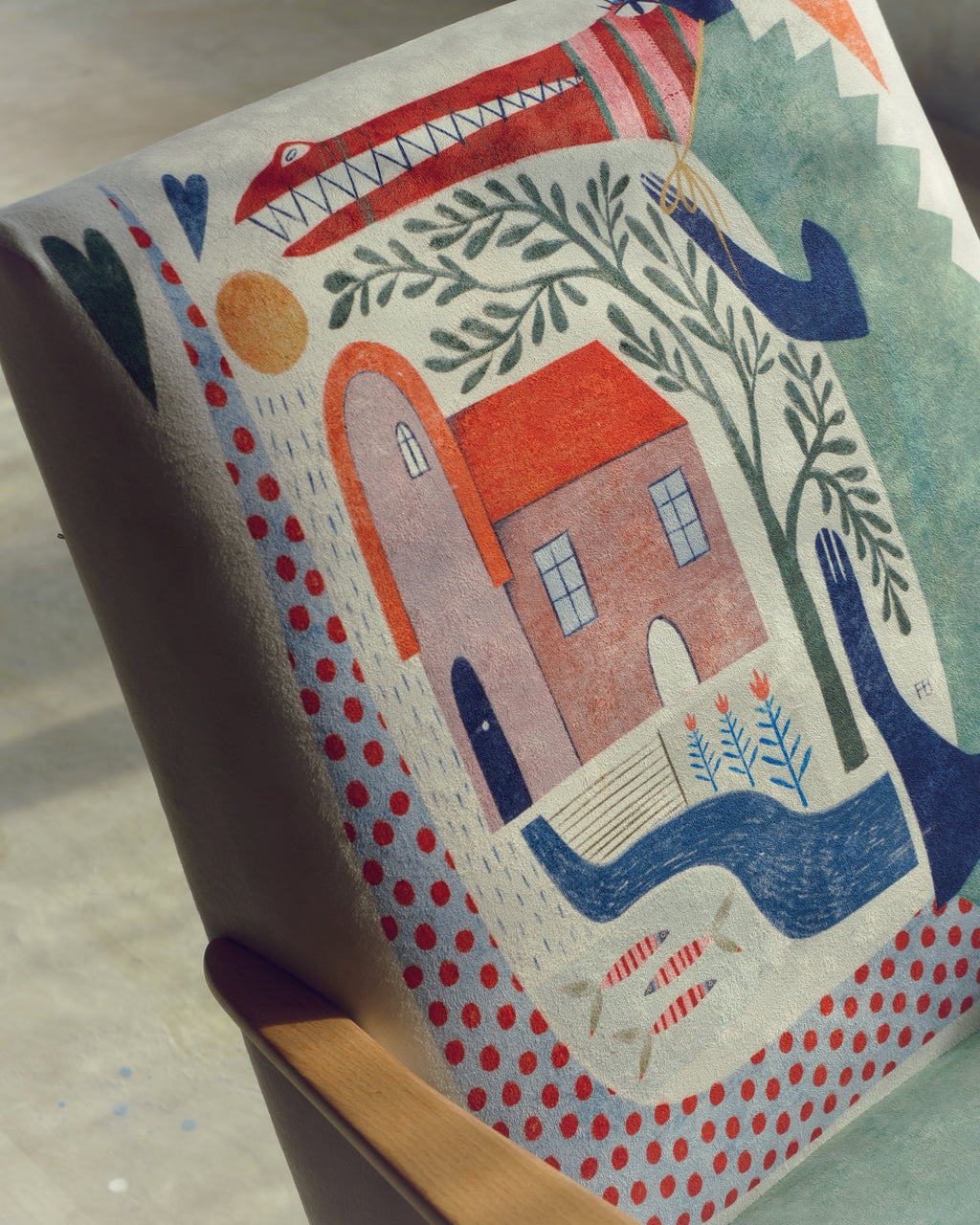 Decorative box with colorful illustration of a house, tree and sun on a neutral background