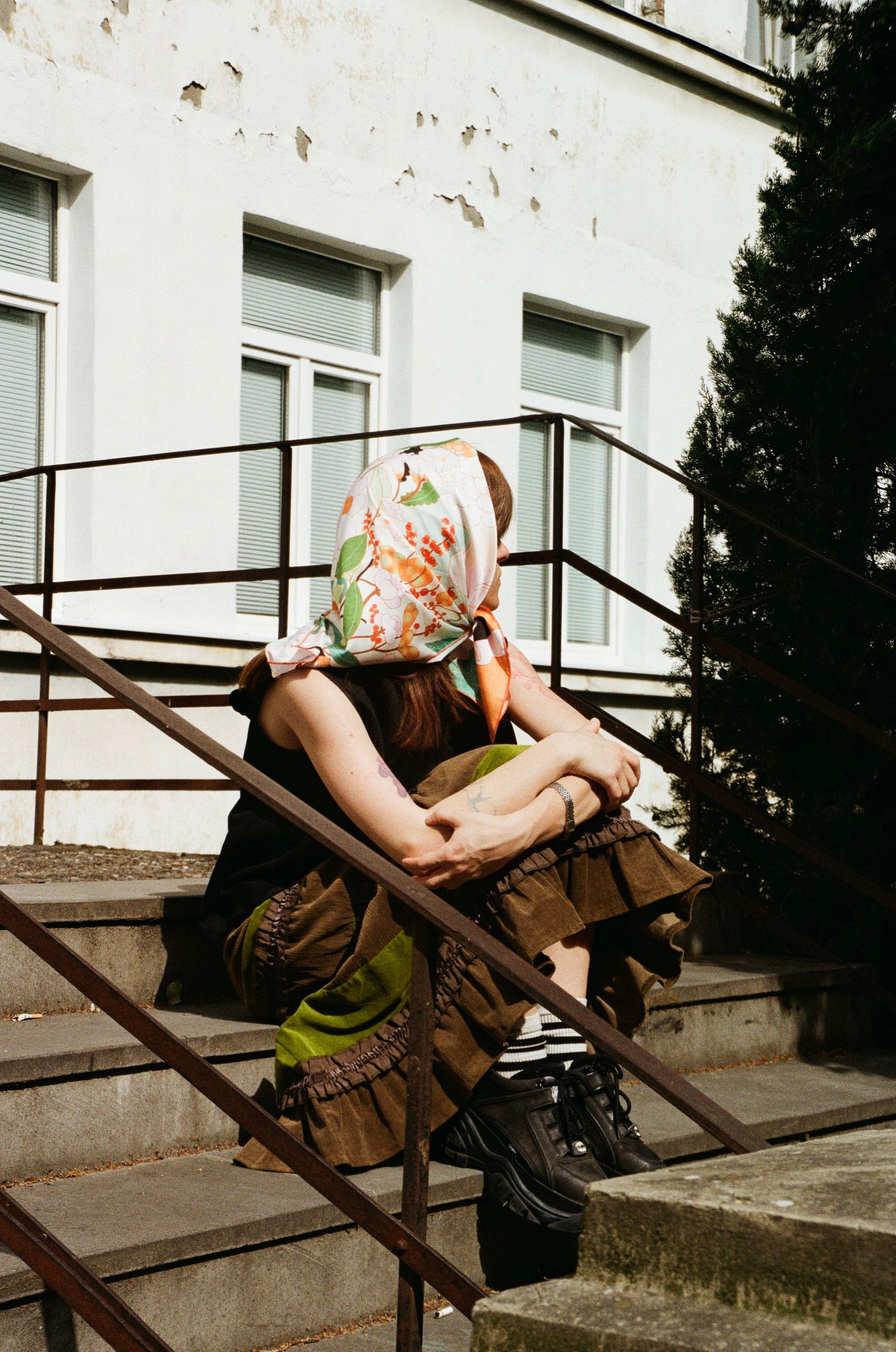 Model wearing Blossom art silk scarf by Leah Han on terrace