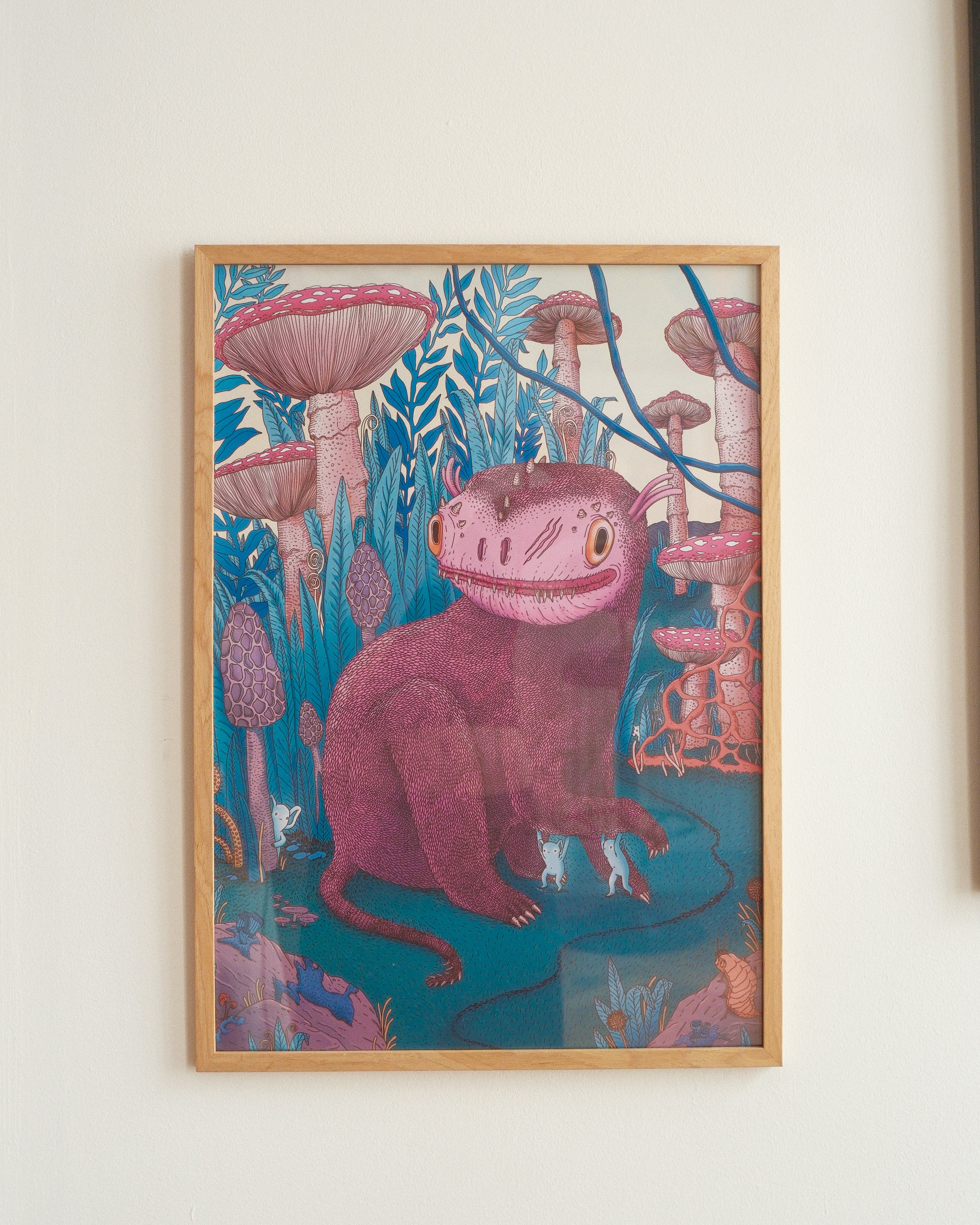 Framed artwork of a creature with a mushroom helmet in a forest setting