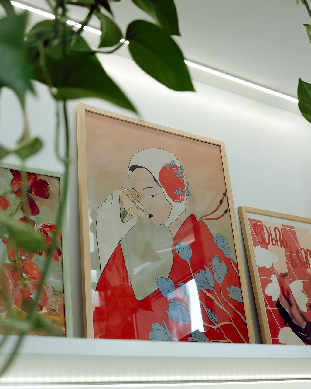 Framed artwork on a wall with decorative elements