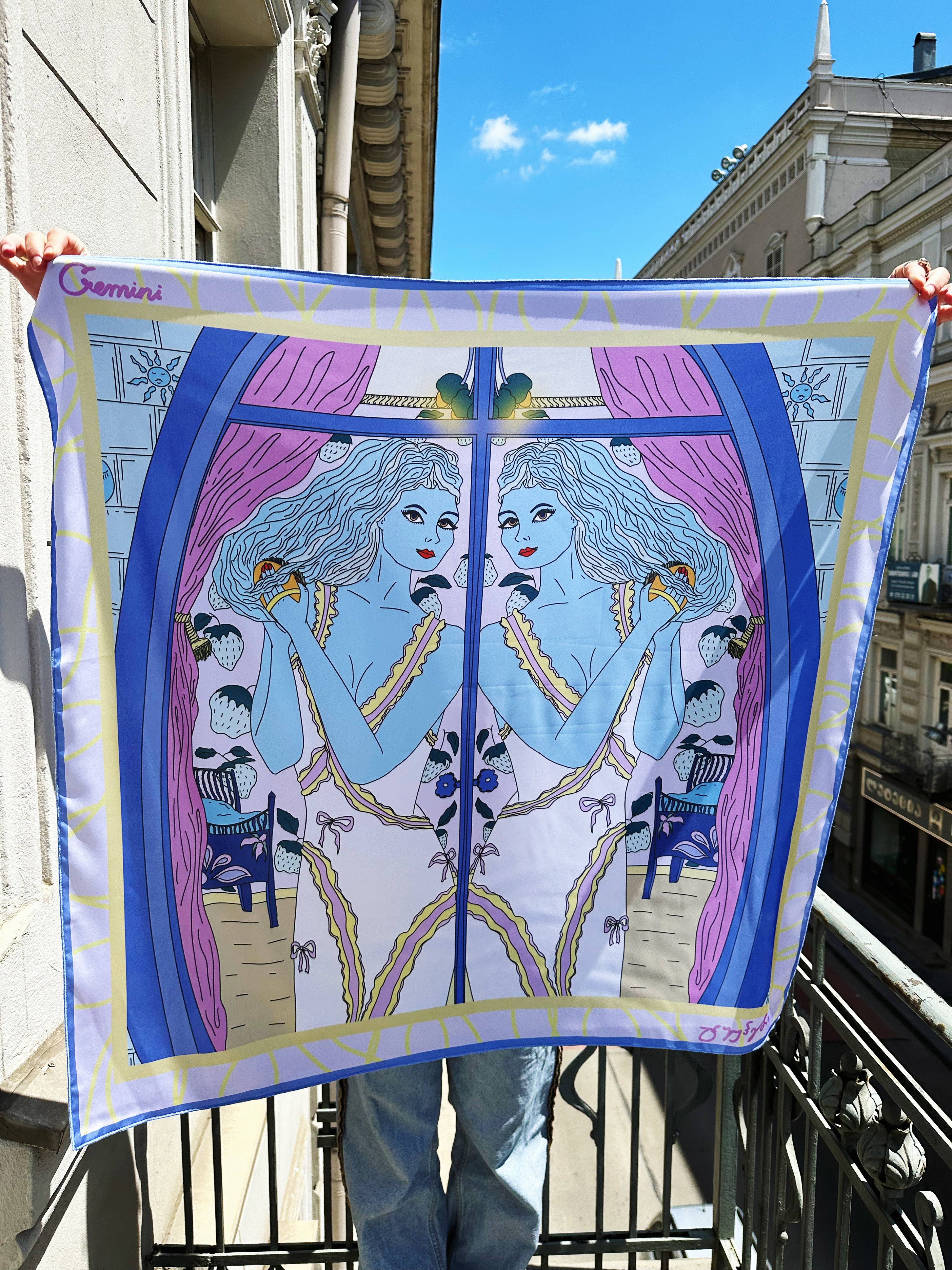 Gemini zodiac scarf displaying vibrant dual motifs and soft gradient tones