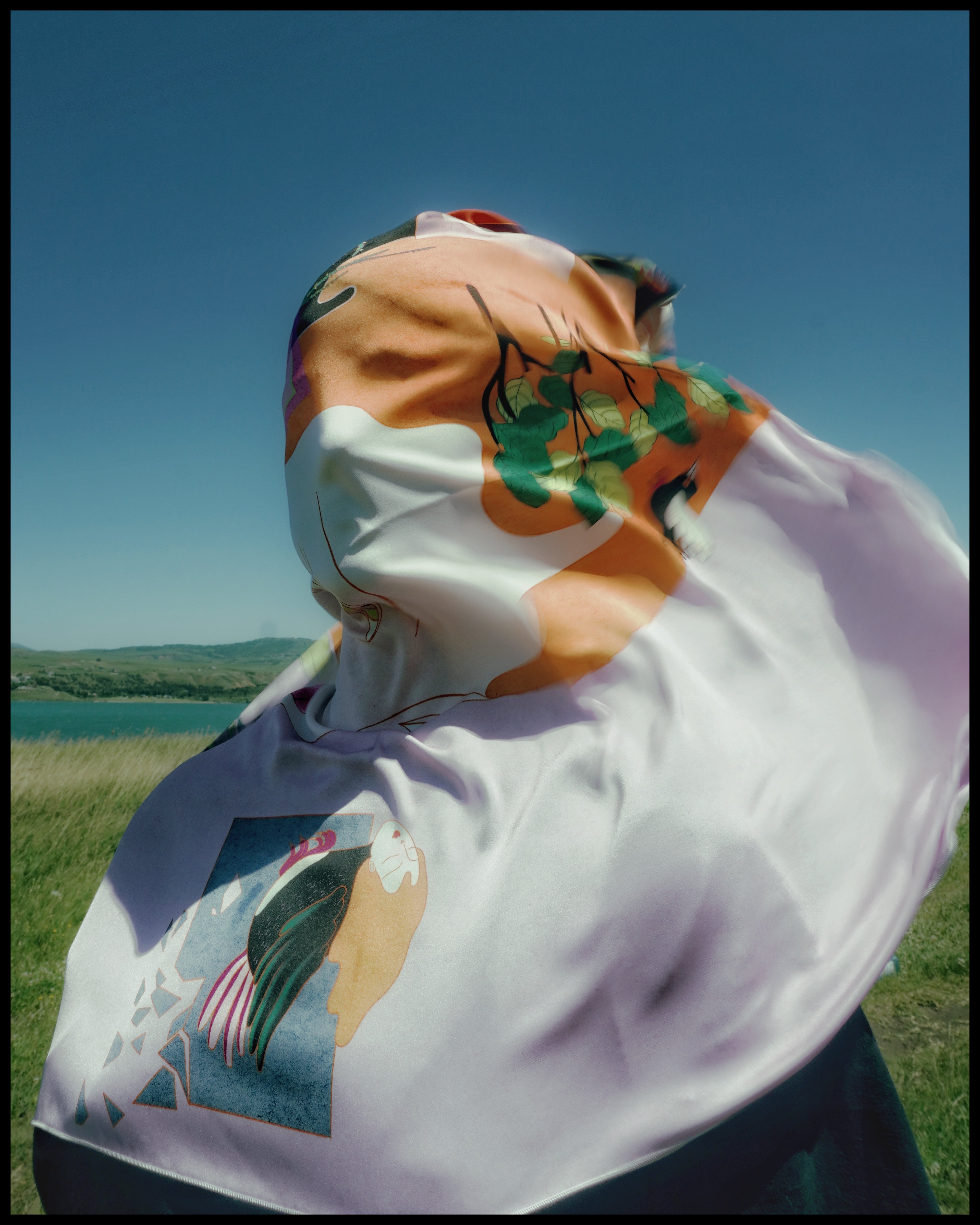 Model wearing art silk scarf The Illusion of Control by Leah Han