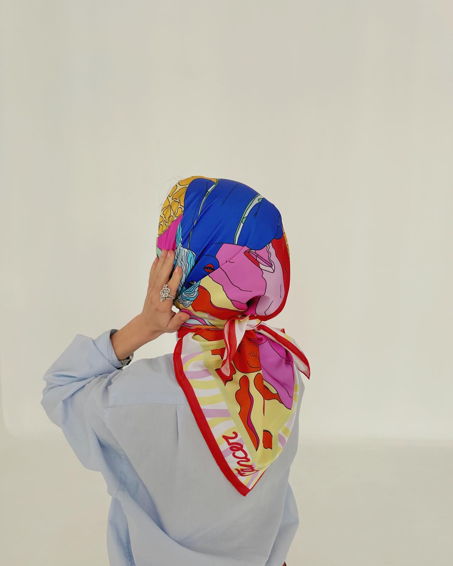 cancer zodiac scarf, on model in white studio