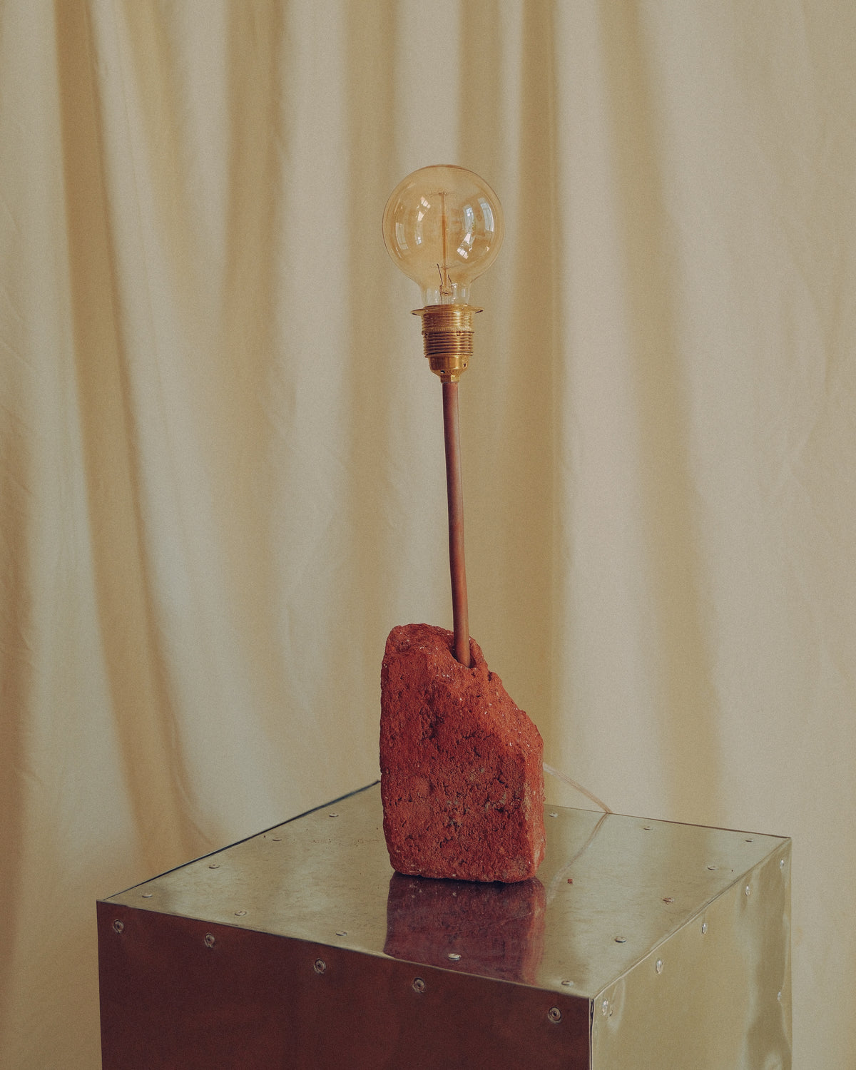 lamp by DAE on the white backgorund, made with brick and meta;