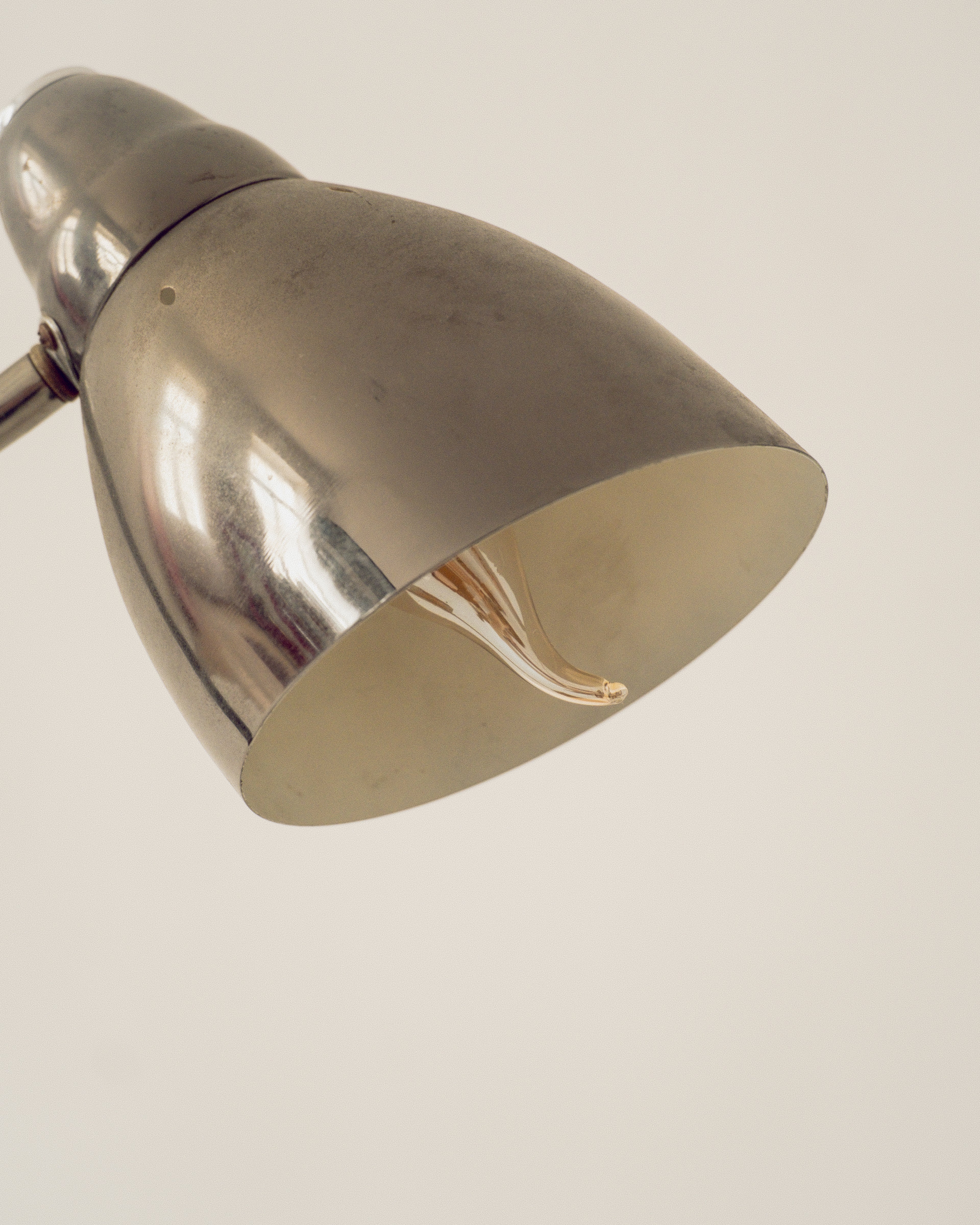 Metallic lampshade on a plain background