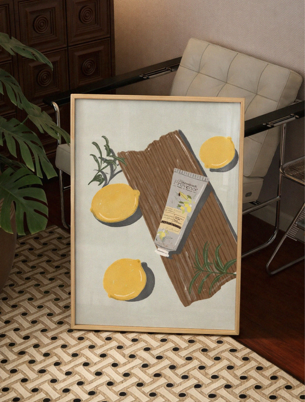 Framed artwork of a package with lemons on a textured floor