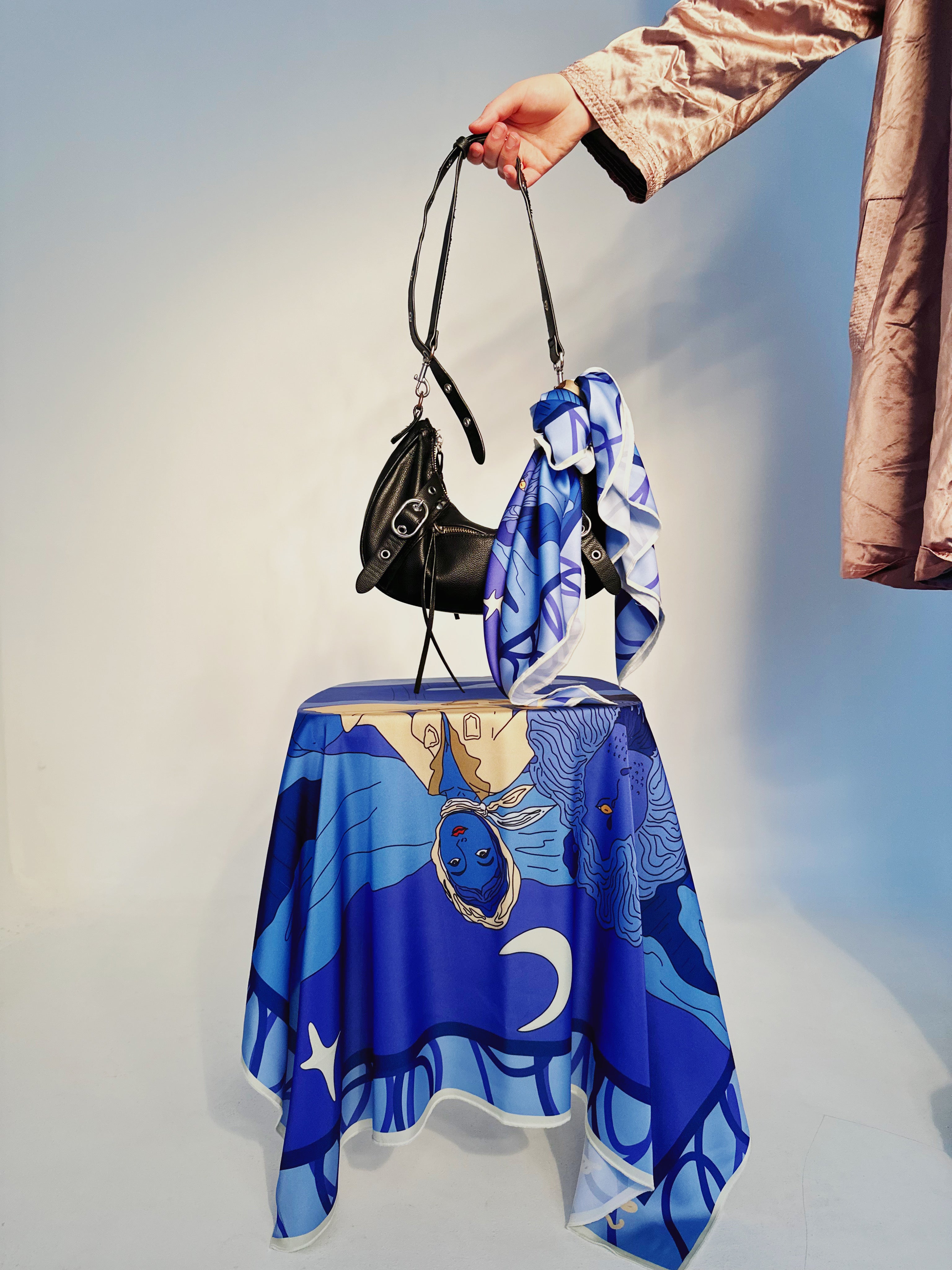 Leo zodiac silk scarf featuring strong symbolic motifs and vibrant artwork