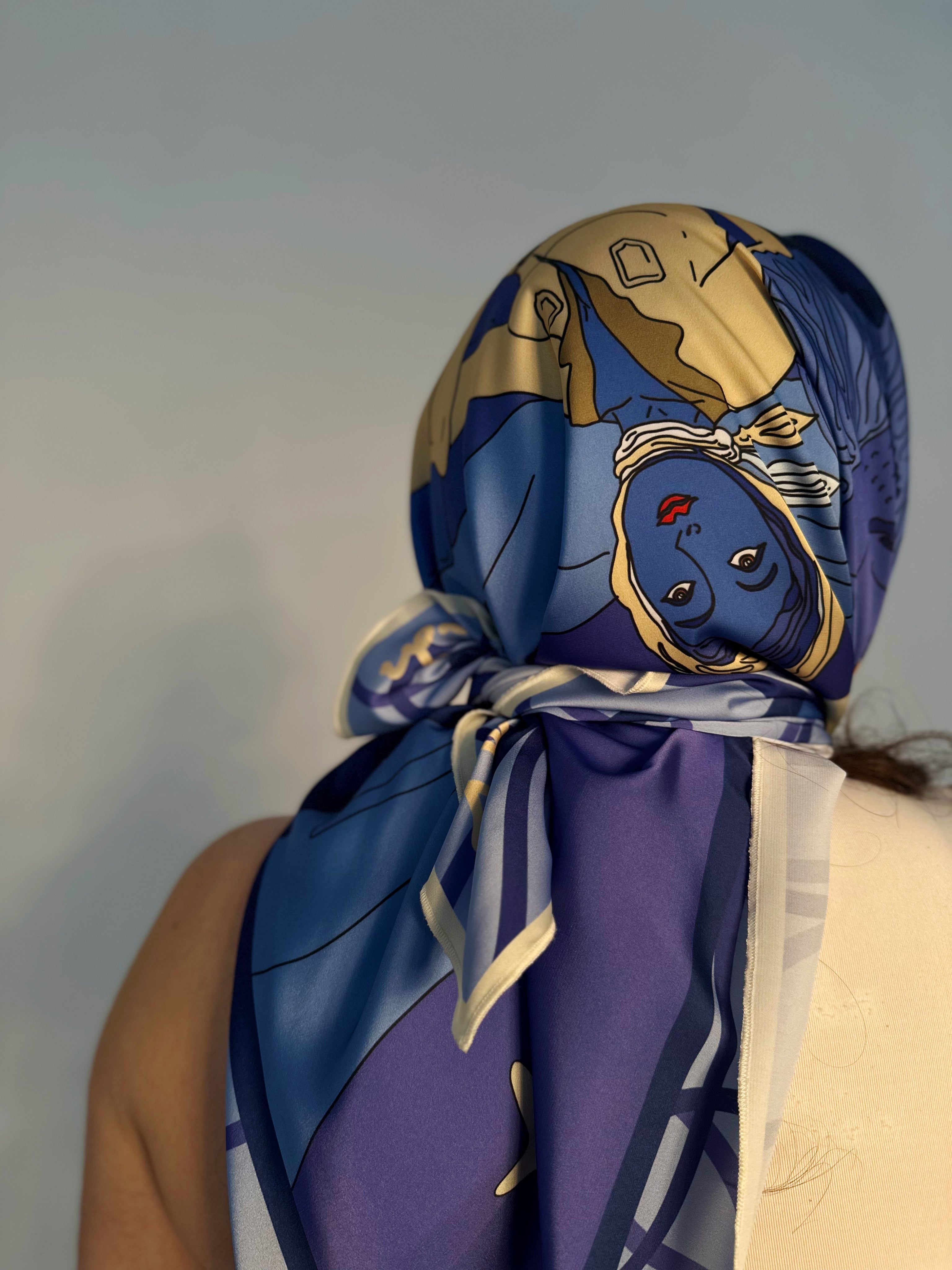 Model wearing Leo zodiac illustrated scarf with expressive color palette