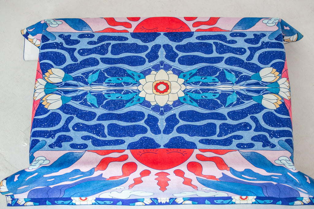 Blue and red “Moon” tablecloth on dining table – artwork by Anano Kevanishvili