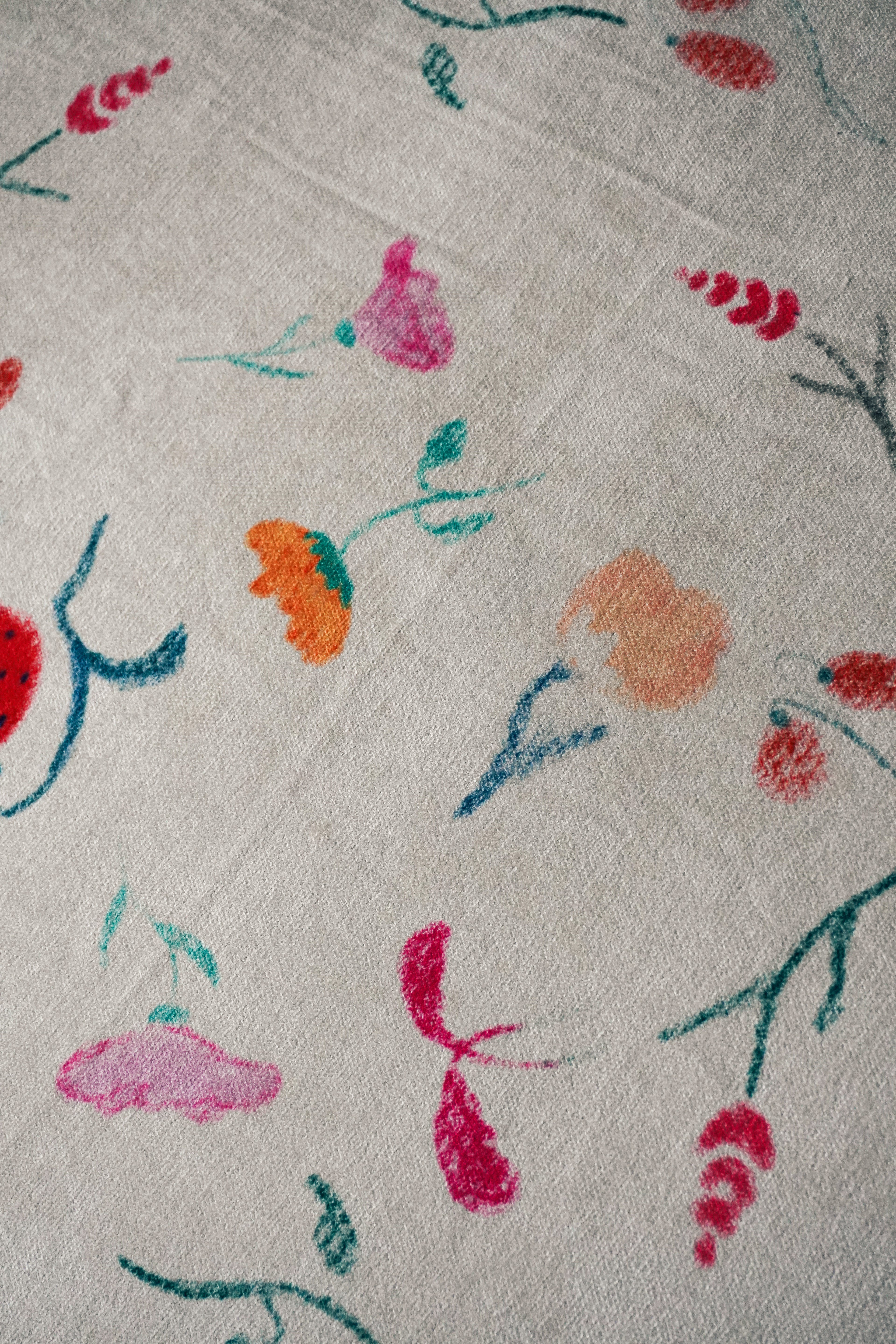 Close-up of the “Muted Garden” design showing delicate botanical details.