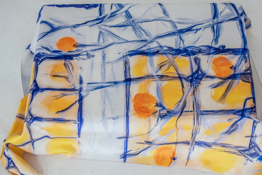 Persimmon tablecloth laid out flat – artistic design with warm orange shades