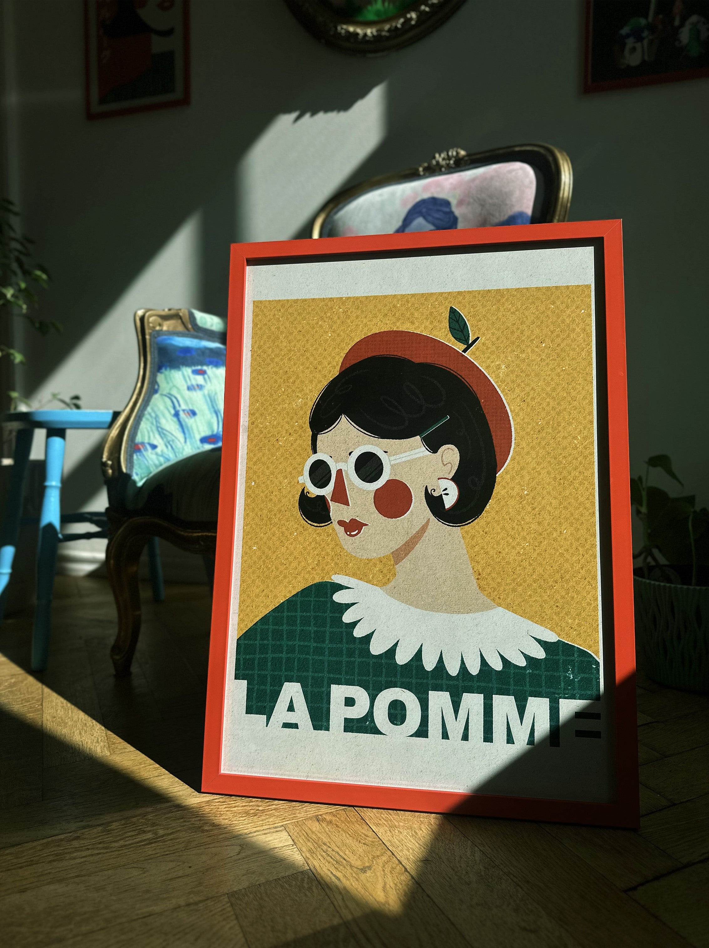 poster on the floor with french word la pomme, apple design