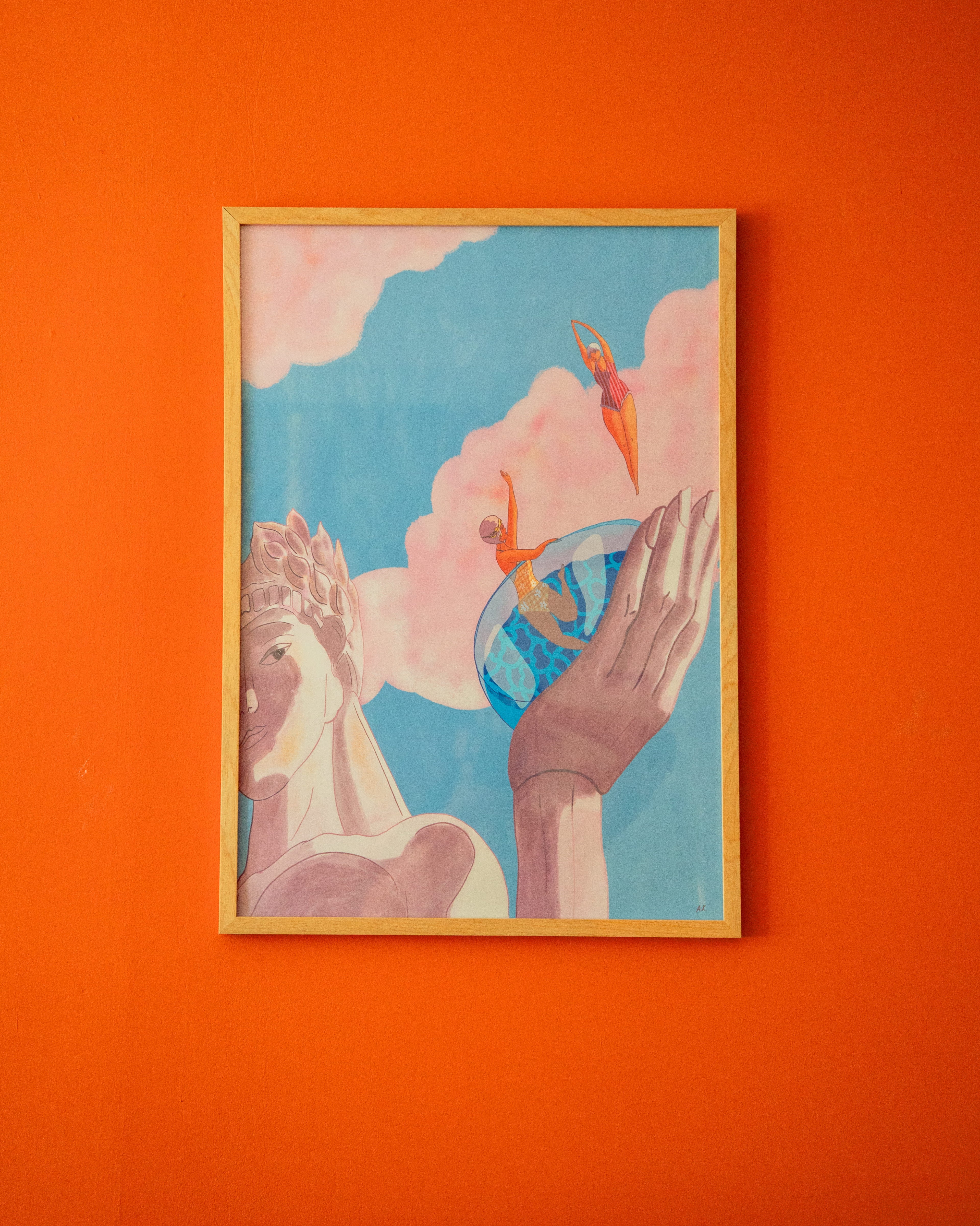Framed artwork with abstract design on an orange wall