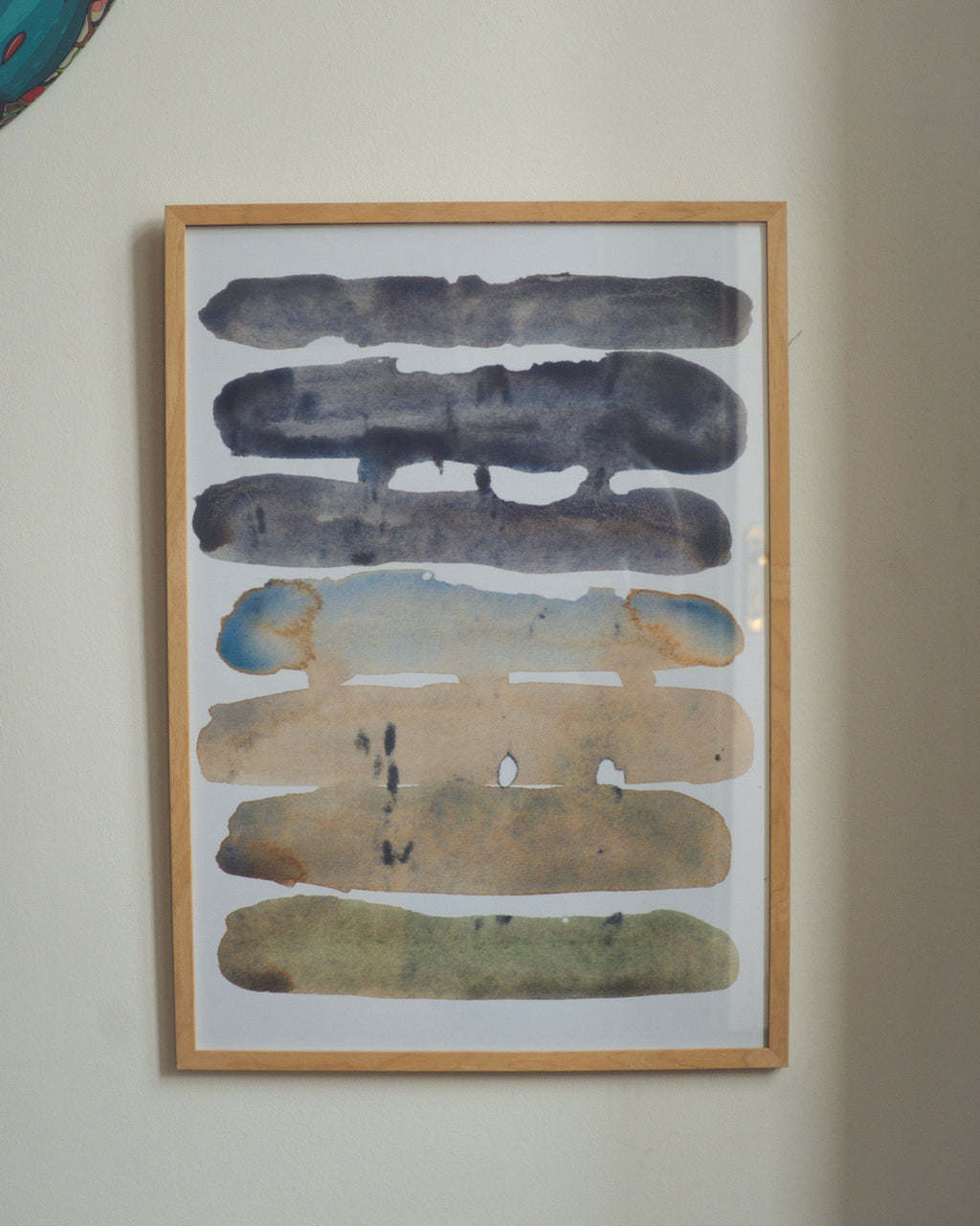 Framed abstract artwork on a wall
