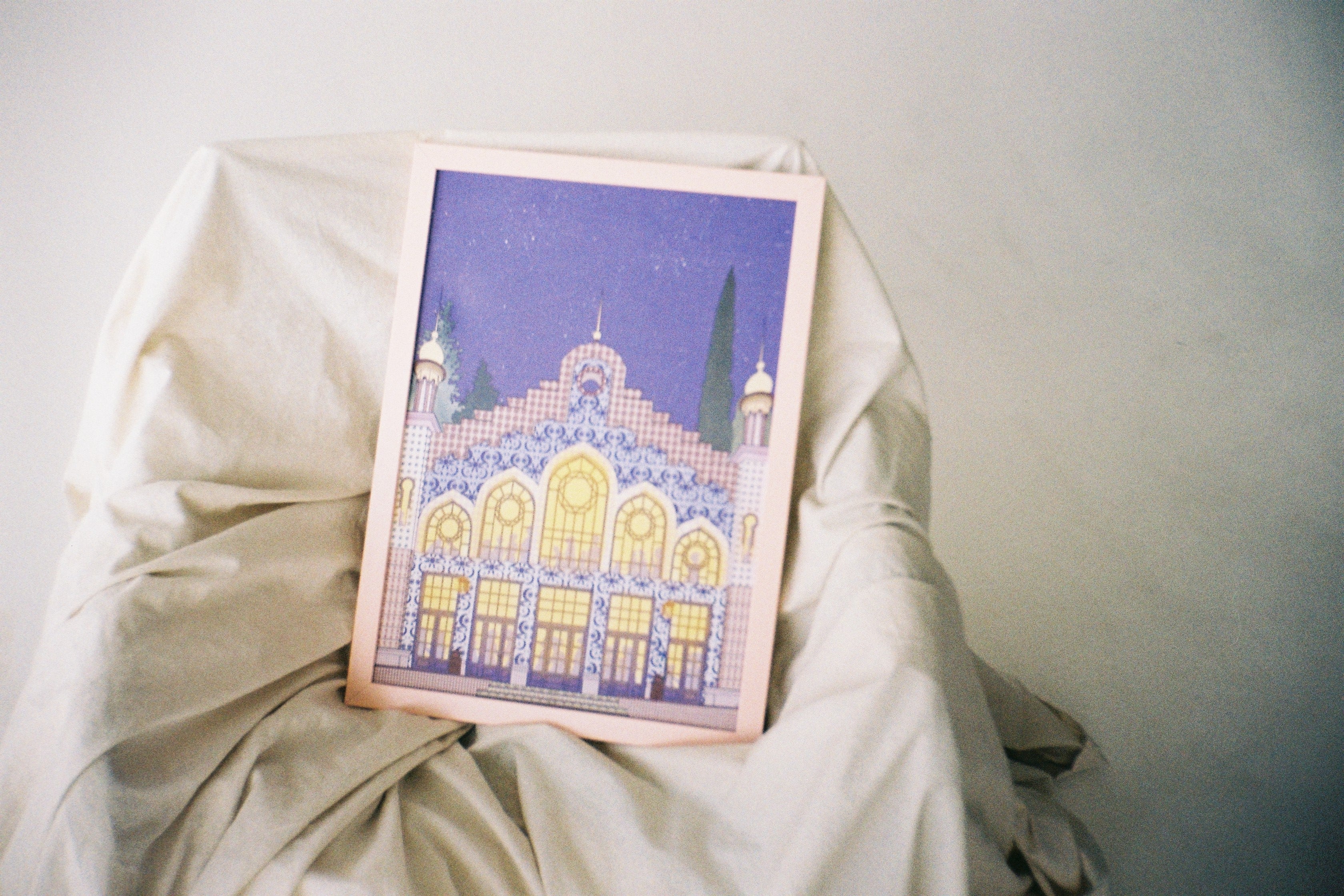 poster of city Tbilisi's architectural piece, in old, asian style. Colorful print. white background, pink frame