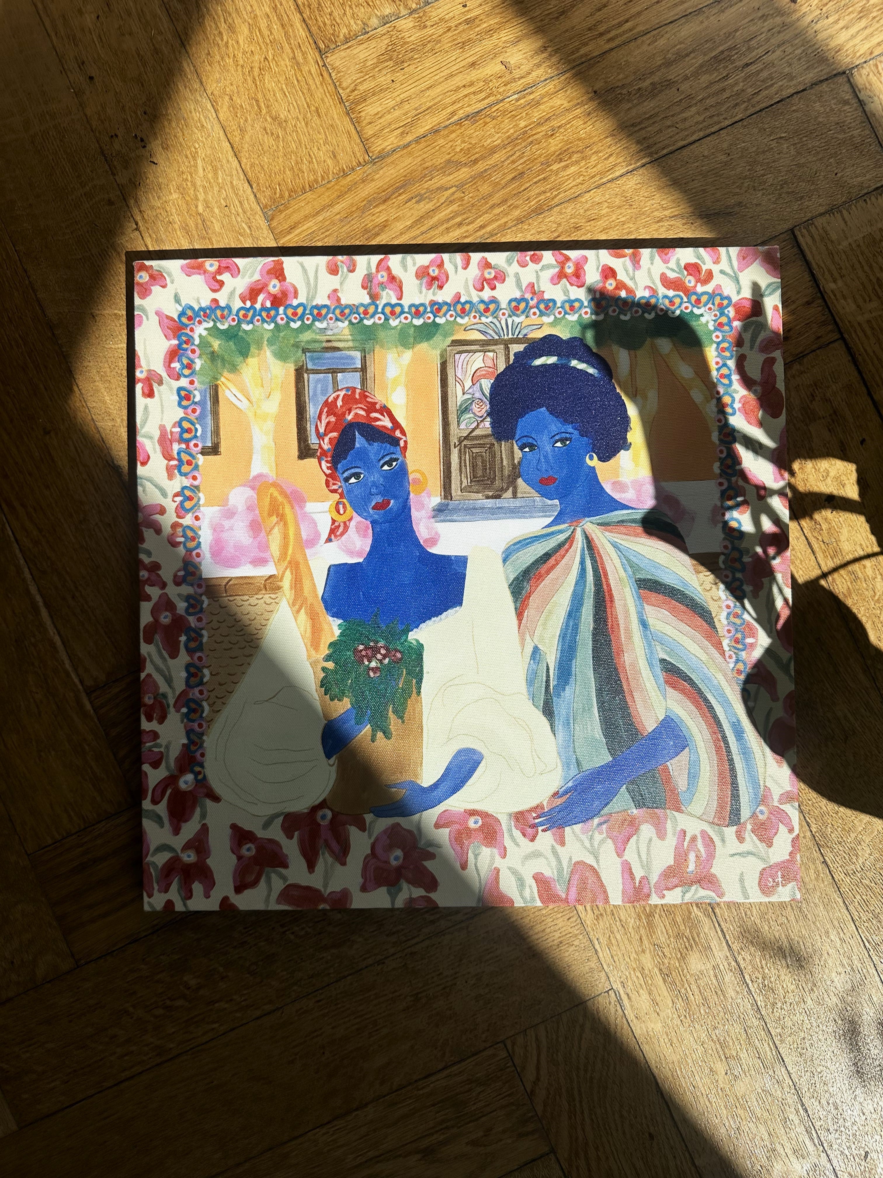 Art poster “Mother & Daughter” by Anano Kevanishvili displayed on the floor