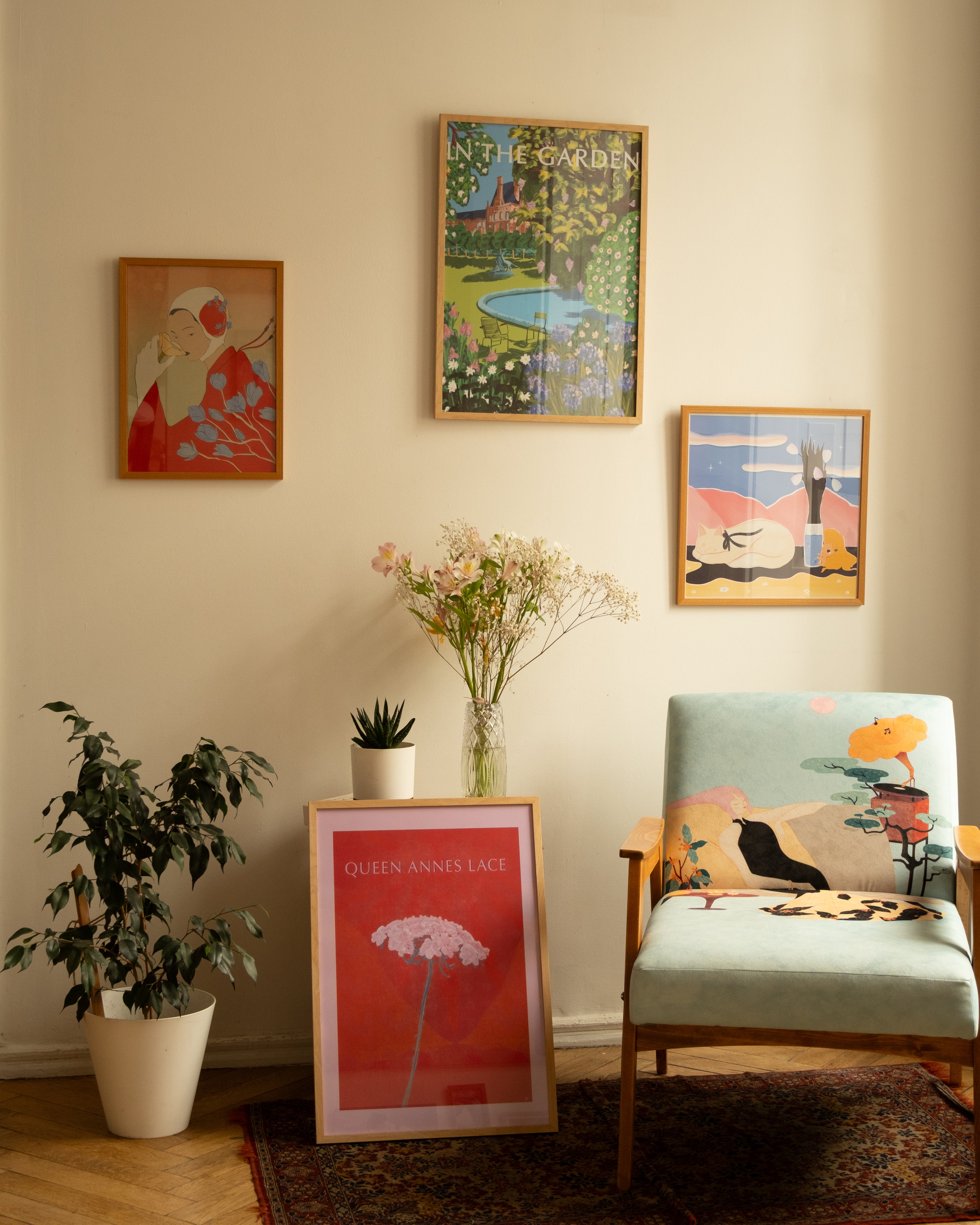 Minimalist floral poster with soft pink bloom and bold red tones for modern interiors - standing in room with other interiors
