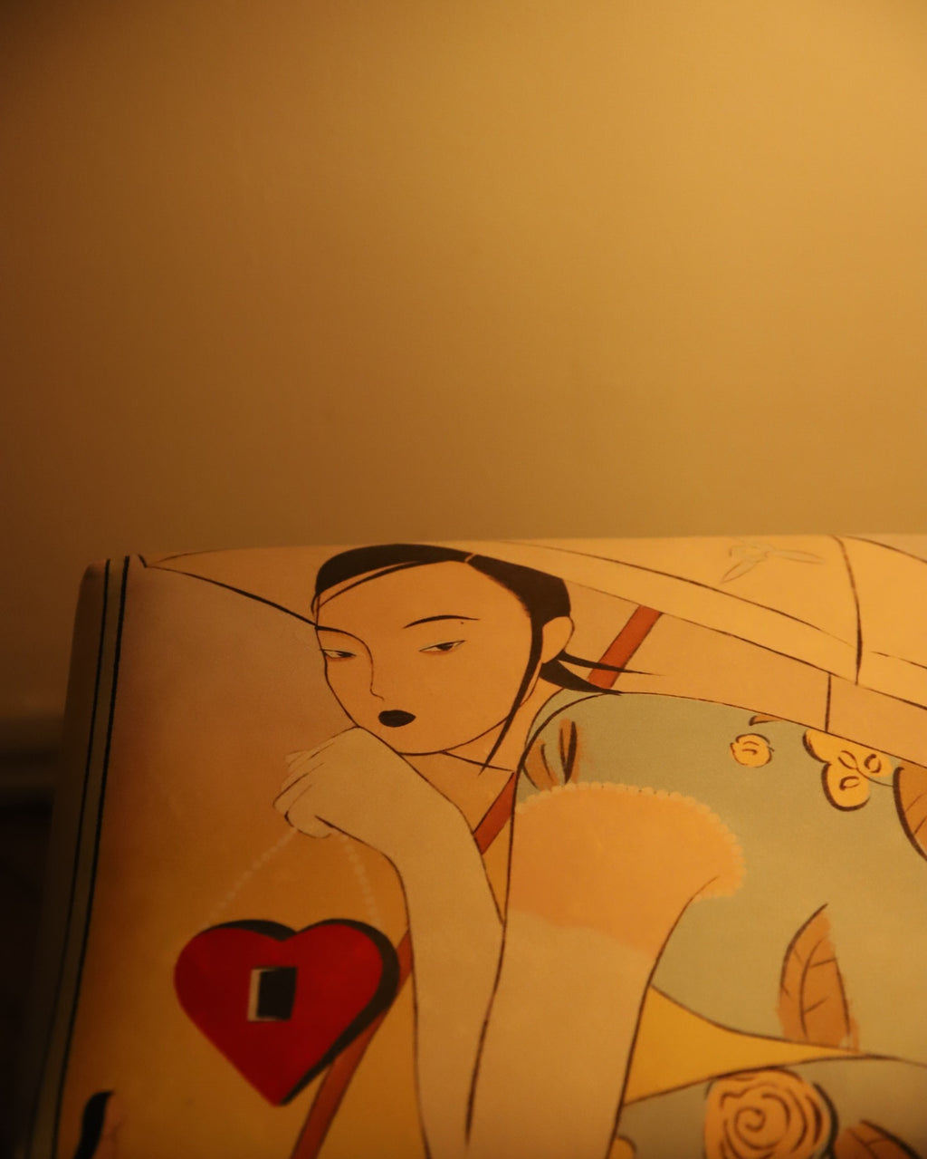 Illustration of a woman with a heart and roses on a lamp.