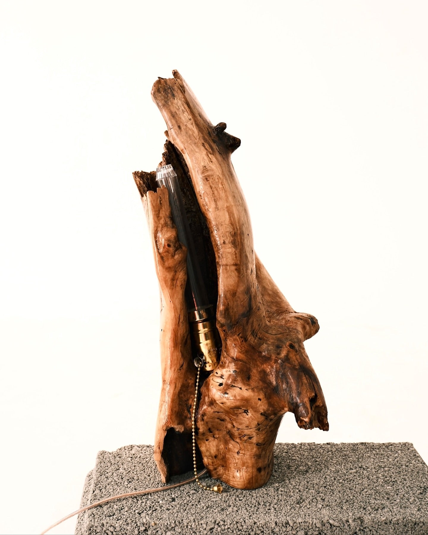 Wooden lamp with a natural, rustic design on a white background