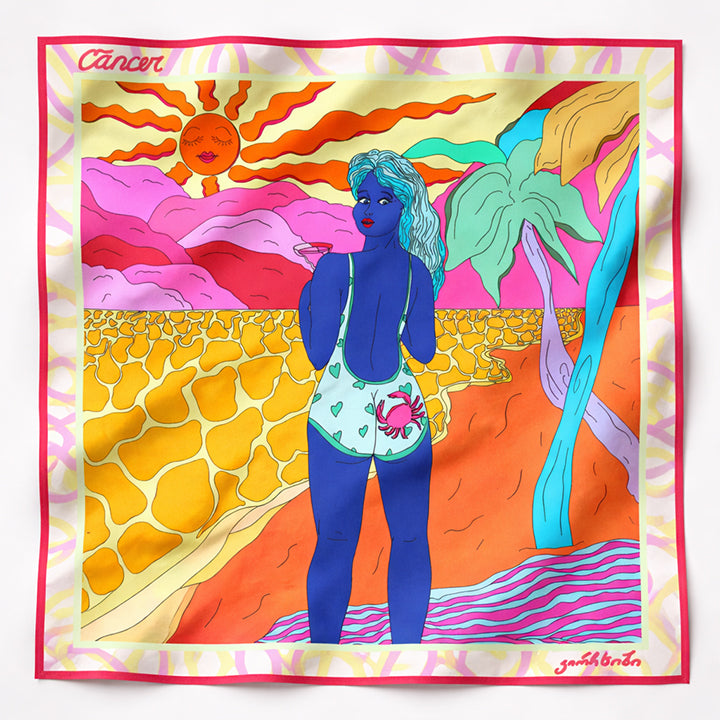 Colorful scarf with a design of a person at the beach, palm trees, and sun.