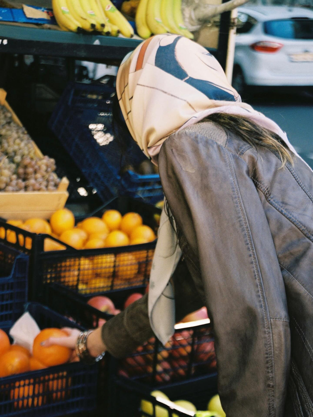 girl buying fruits and wearing scarf by DAE