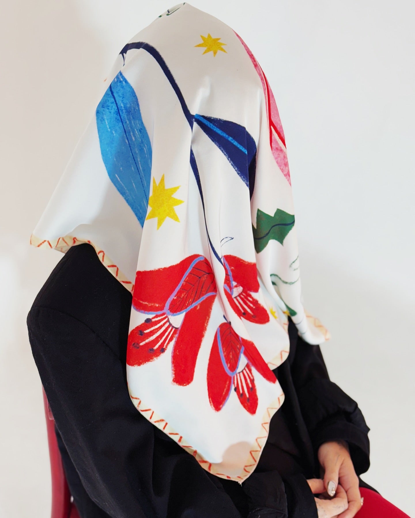 Close-up of Bloom art silk scarf showing expressive floral elements