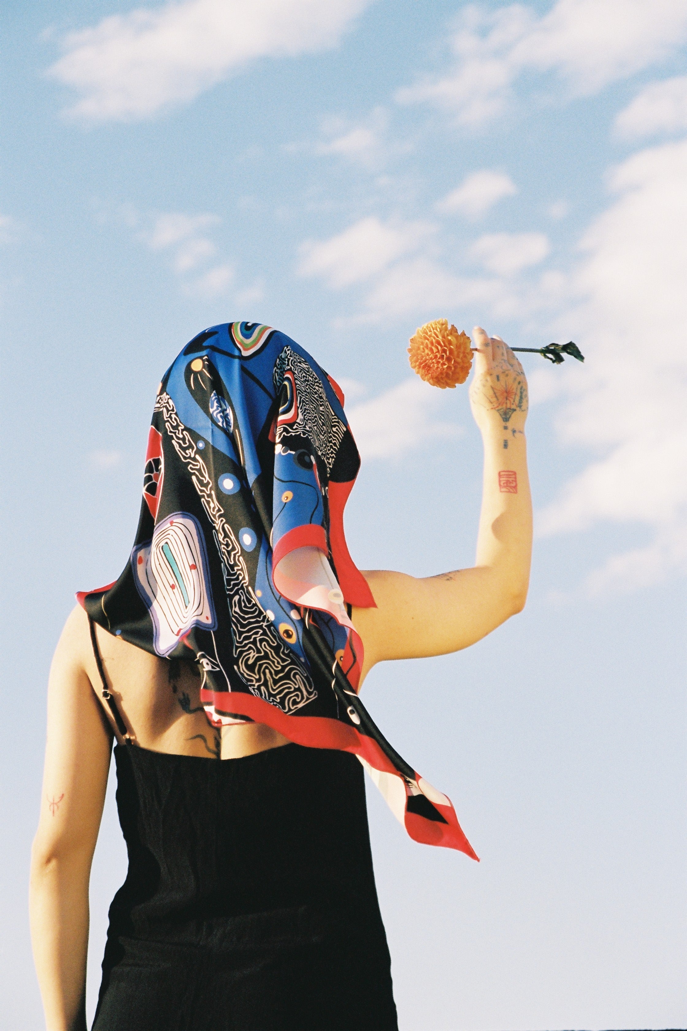 Model wearing Colorful Tale art silk scarf by Nino Bakuradze