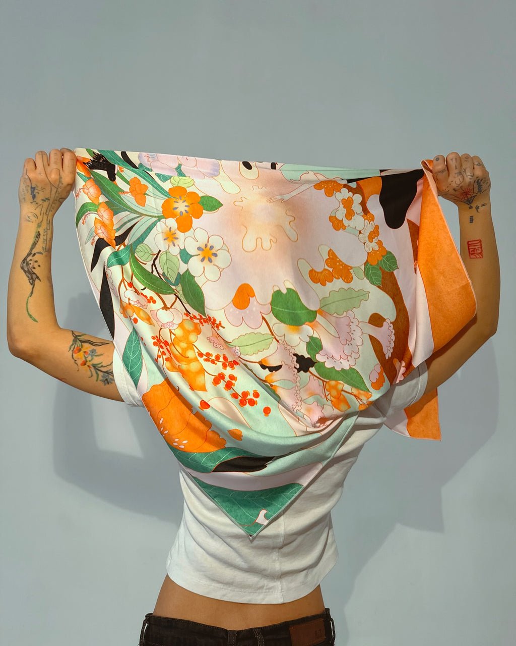 Close-up of Blossom silk scarf with nature-inspired artwork