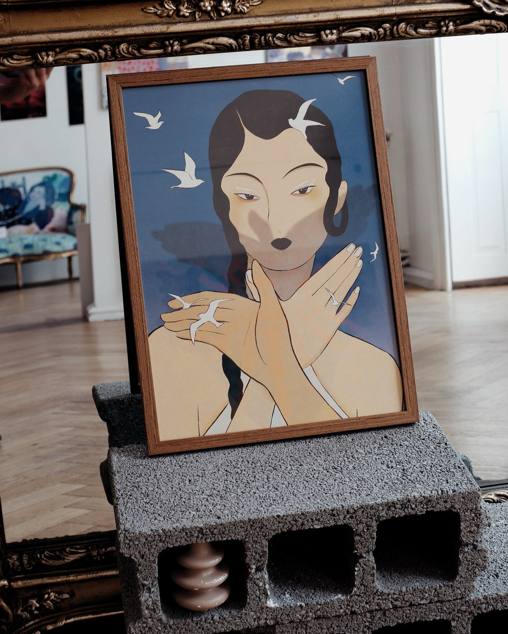 Poster “Shadow” by Lea Woo in wooden frame, placed on blocks