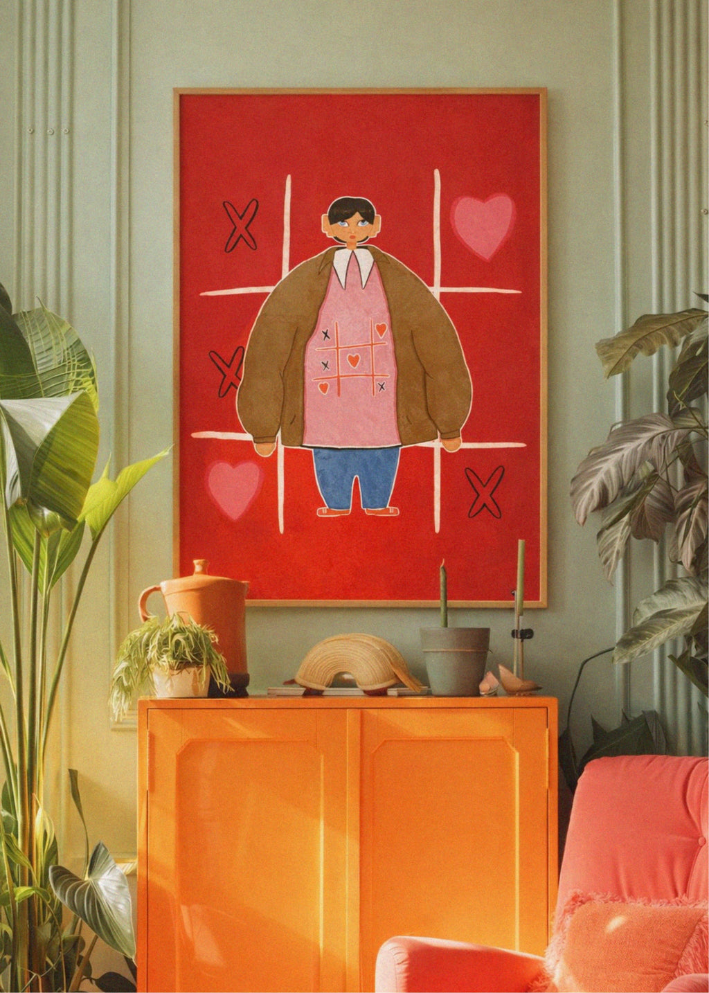 Colorful room interior with a red abstract painting of a person, an orange cabinet, and a pink chair.