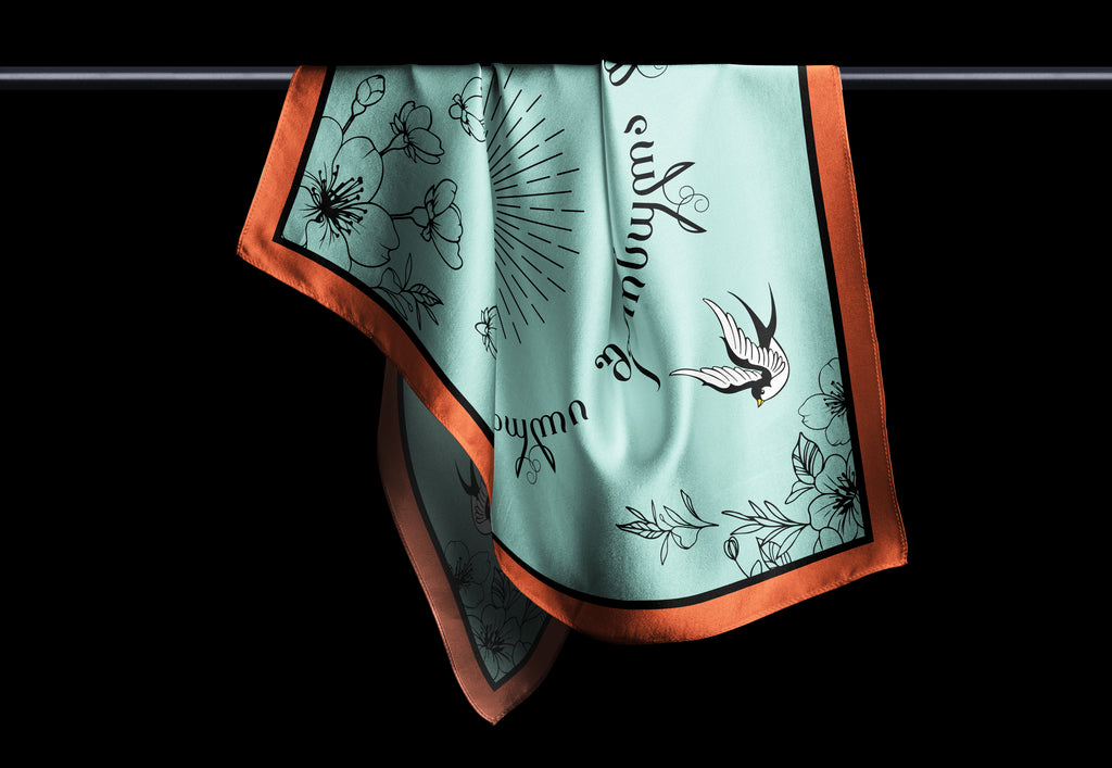 Close-up of Georgian Spring scarf corner and print details, silk-feel fabric