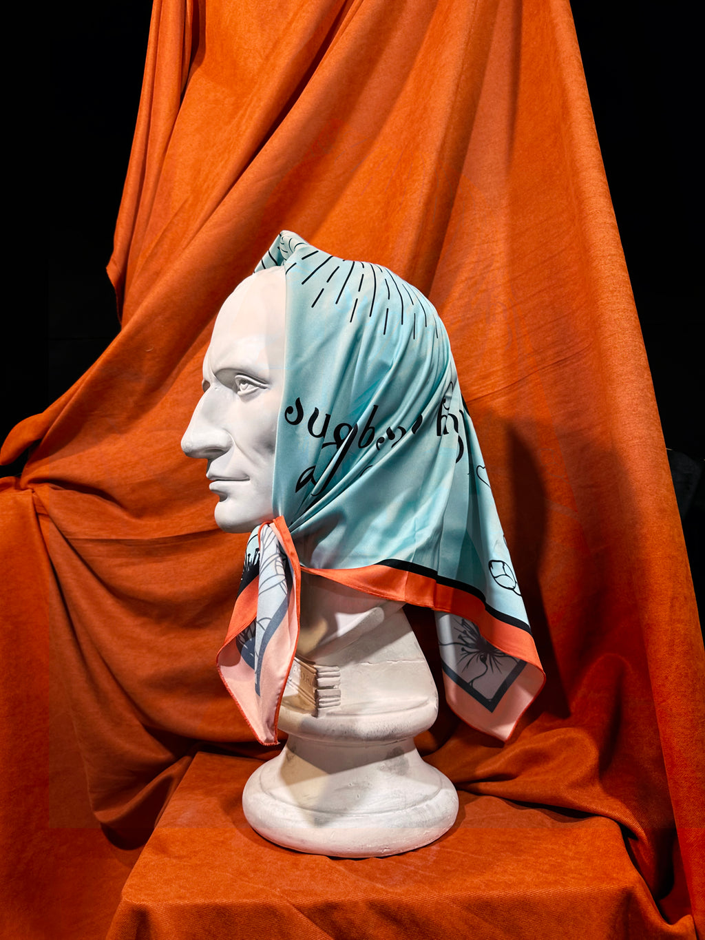 Model wearing Georgian Spring artificial silk scarf, artist-designed scarf by DAE