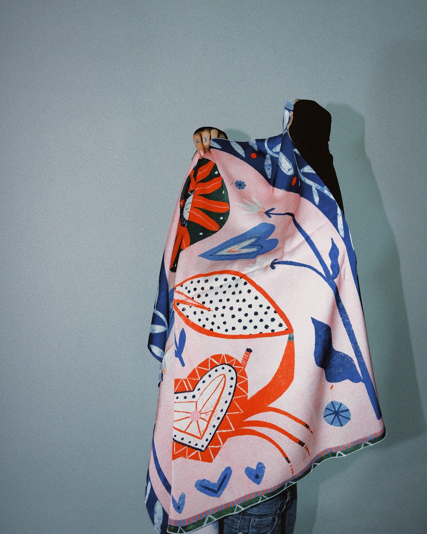 Model wearing the Sun and Cancer zodiac scarf by Feli Beringer