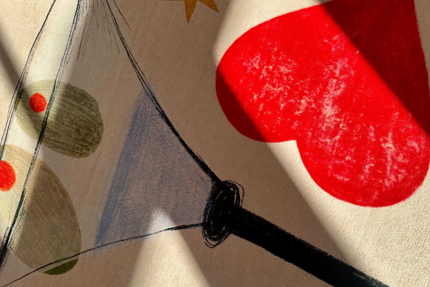 Abstract art with geometric shapes and a red heart on a beige background