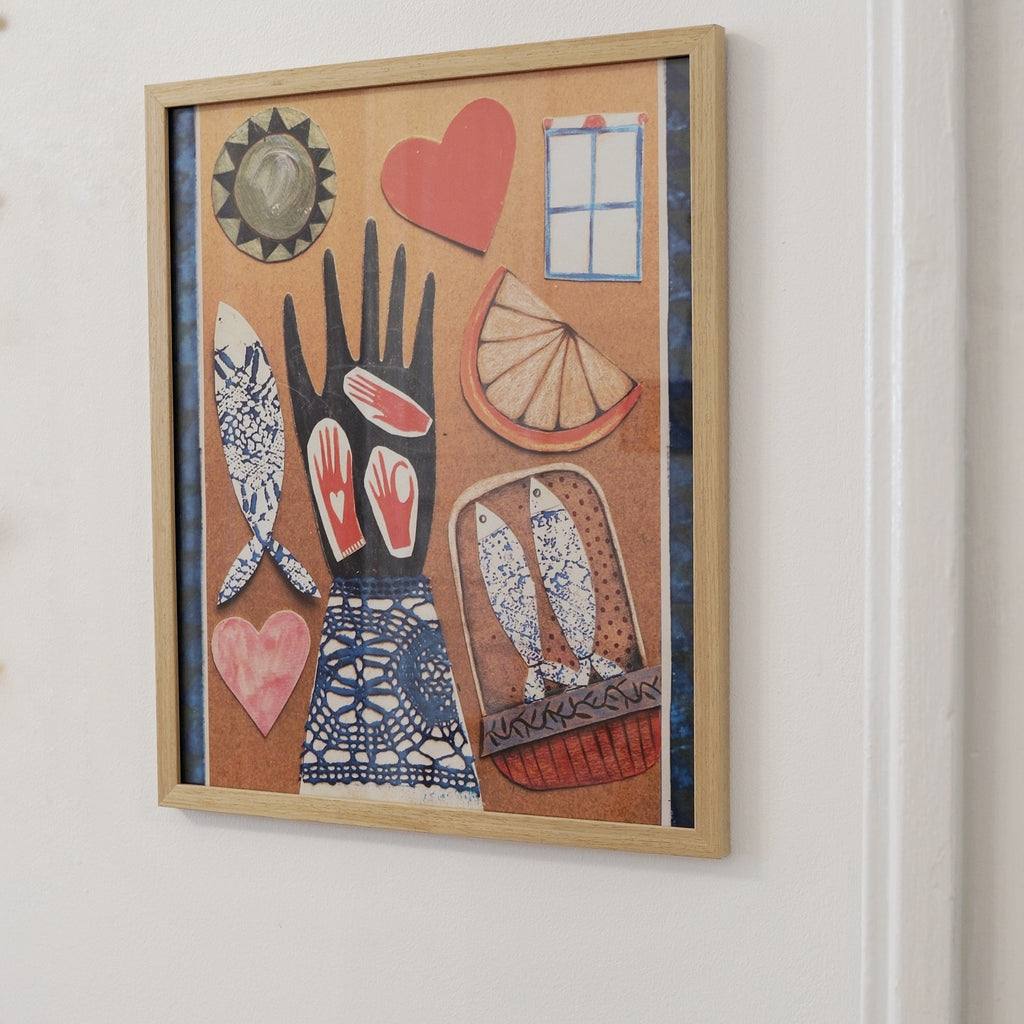Framed artwork with abstract designs on a white wall