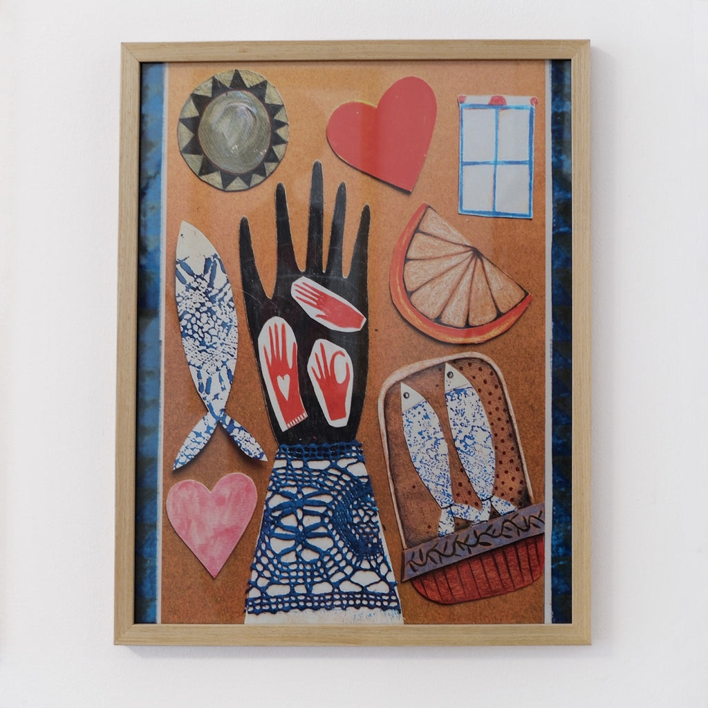 Framed artwork with abstract designs including a hand, fish, and hearts on a white background