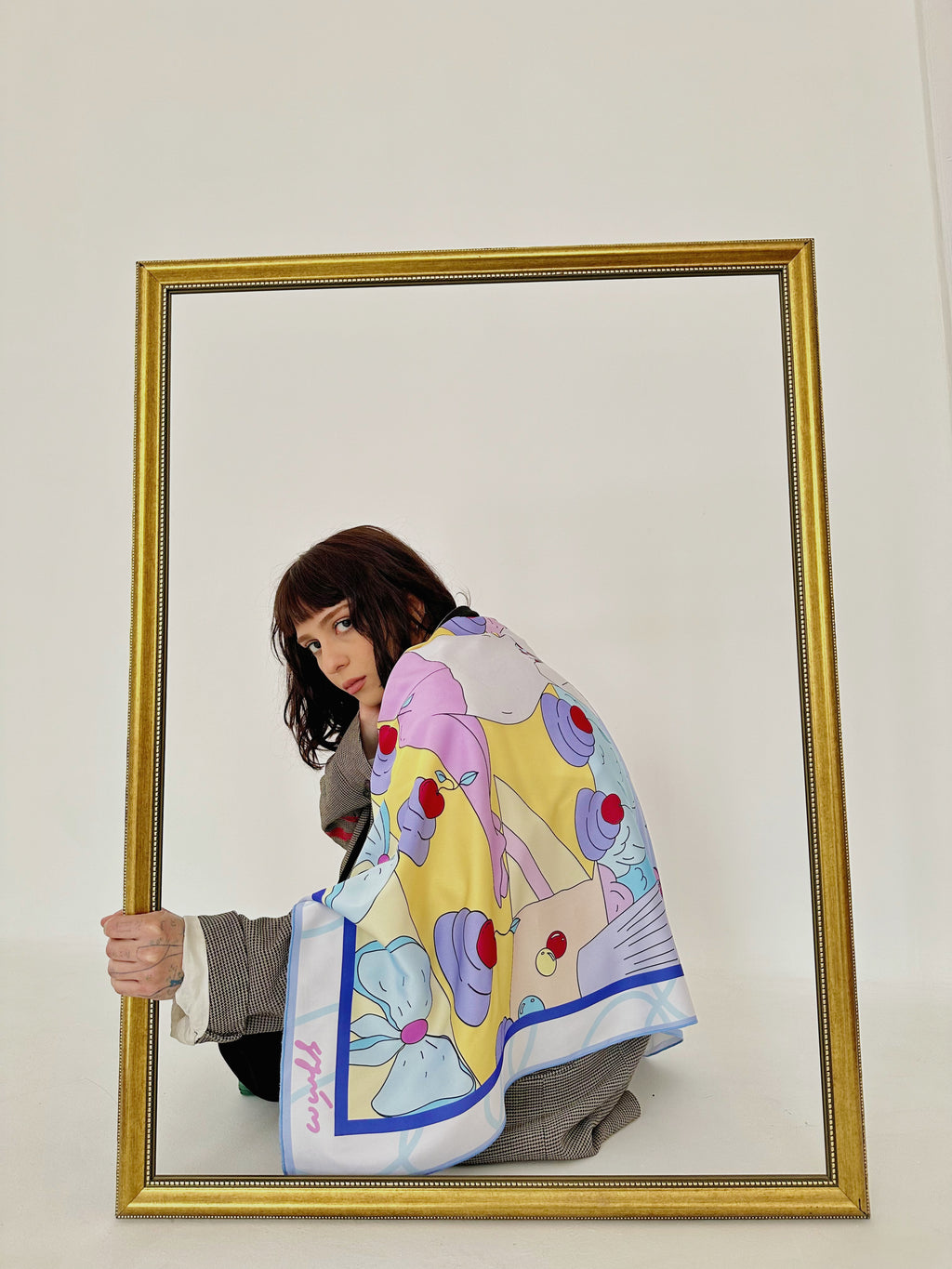 Model wearing Taurus zodiac illustrated scarf by Anano Kevanishvili