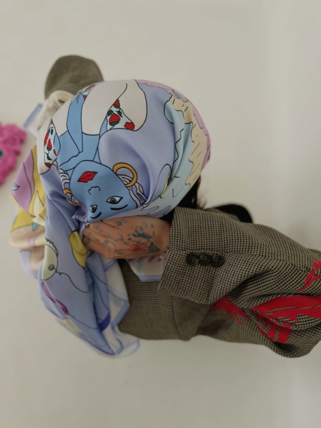 Close-up of Taurus zodiac art silk scarf featuring expressive colors and illustration