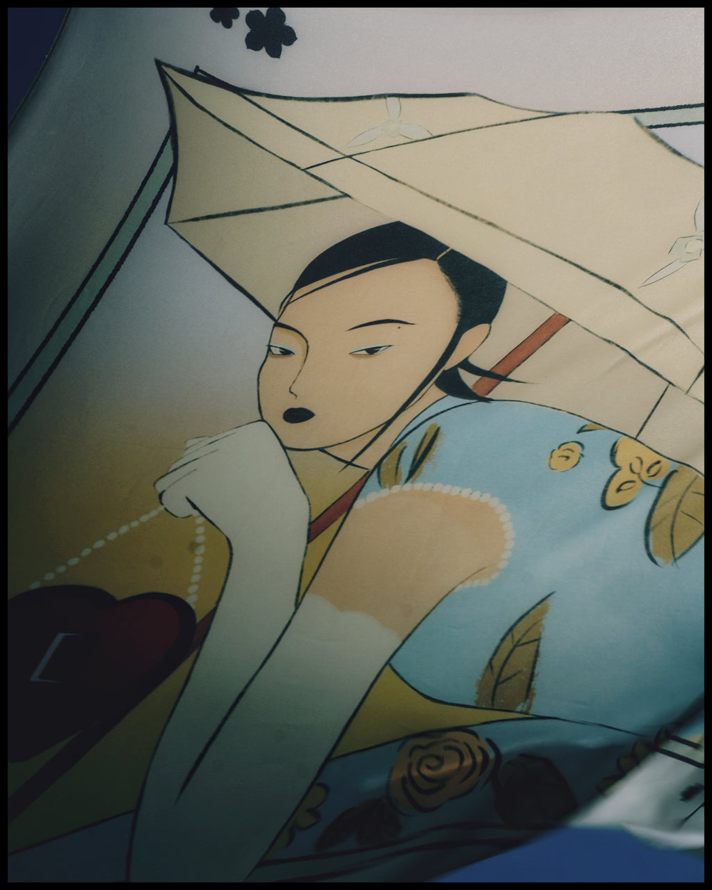 Traditional Japanese illustration of a woman in a kimono holding an umbrella. Close-up of Two Hearts silk scarf showing delicate textures and colors