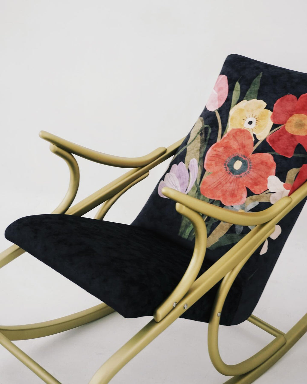 Bloom rocking chair and pouf with floral illustration by Lea Woo