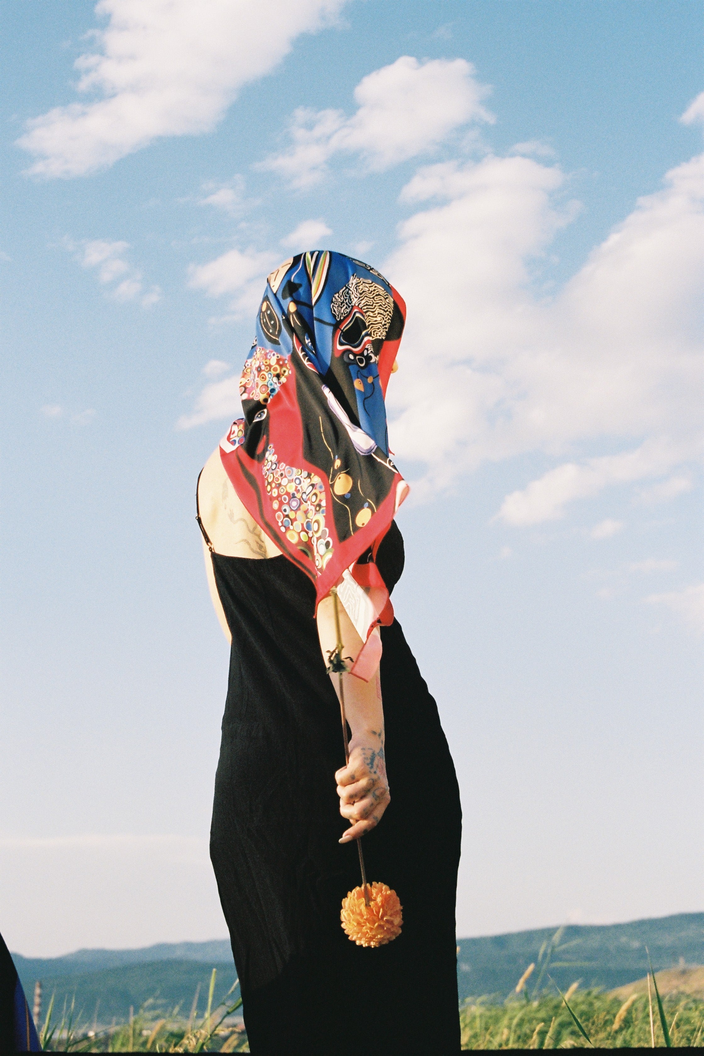 Colorful Tale illustrated scarf in outdoor setting